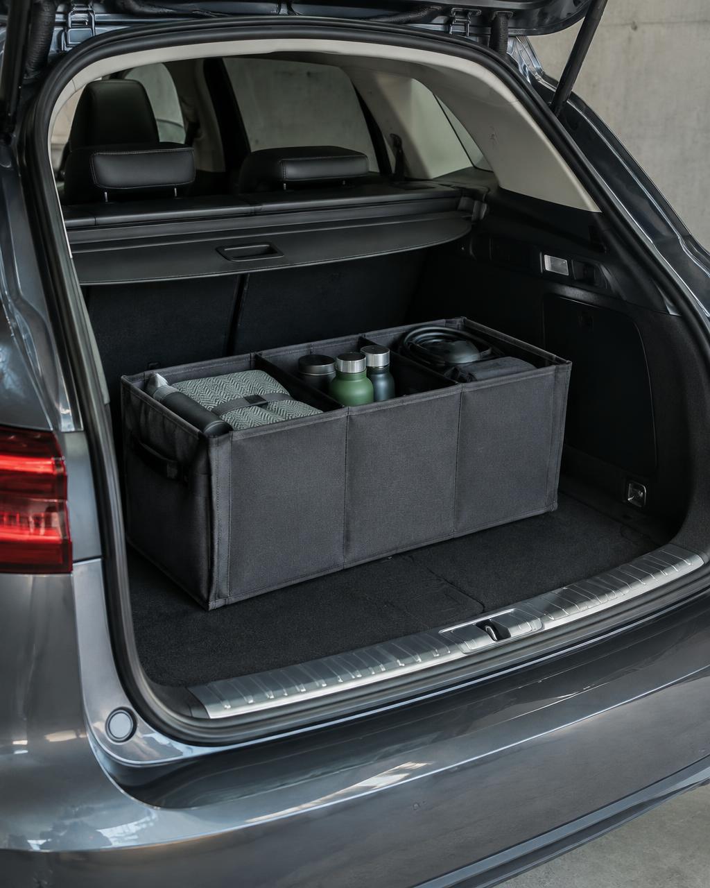 Everyday travel items arranged in a car boot organizer